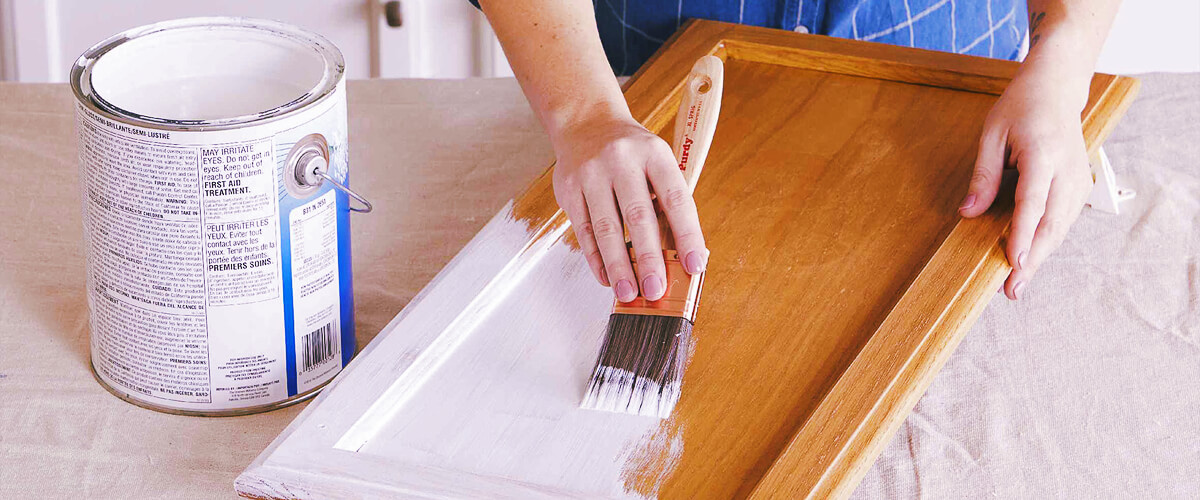 how to paint over stained wood